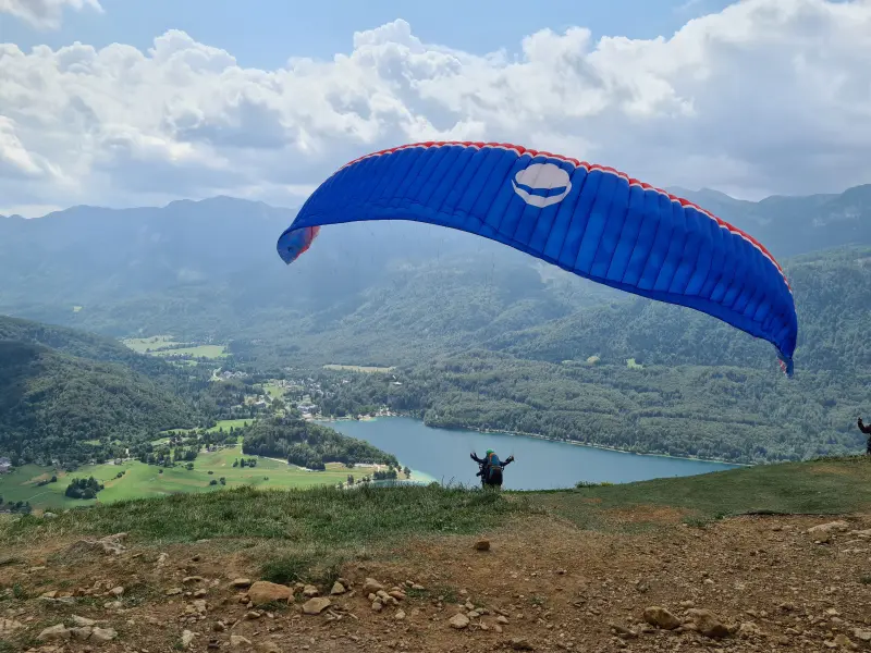 Watching paragliders jump off the hill.